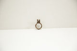 Vintage bronze ring featuring two stylized birds and a rustic, textured band.