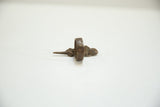 Side profile of a vintage African bronze gecko ring showing its thick band.