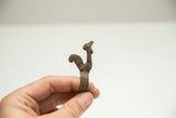 Side profile of the vintage African bronze rooster ring showing its rustic, hand-cast texture.