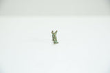 Close-up of vintage African bronze fox charm, showing its back and green patina.