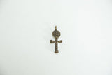 A mid-century cast bronze African charm of a stylized figure in a cross shape.
