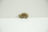 Side view of a vintage Ashanti bronze chameleon showing its detailed lattice pattern.
