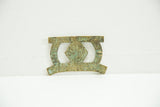 Reverse side of the vintage African bronze buckle showing its cast belt loop.