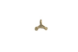 Vintage African cast bronze charm with a triangle shape, textured body, and two spiral motifs.
