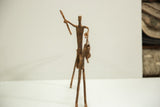 Collector's vintage African horseback warrior bronze casting, side view, showing unique patina.