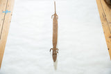 Elongated form of a vintage cast bronze lizard showing its textured, oxidized patina.