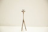 Vintage African bronze giraffe, back view revealing slender form and aged patina.