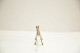 Front view of small African bronze camel showing time-softened patina.