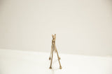 Blurred front view of vintage African bronze camel casting.