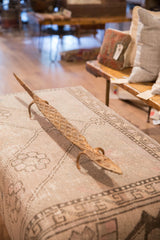 Vintage iron lizard sculpture with diamond-patterned body texture and rich patina.