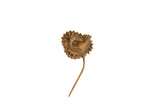 Collectible vintage bronze bird pin with a detailed, serrated medallion and antique patina.