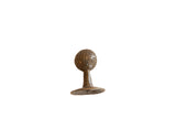 Vintage bronze Tritcraf ball on stand, dimpled texture with warm patina, 1.5x2.5 inches.