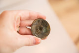 Vintage Bronze Tritcraf ball's bottom, showing embossed signature and rich patina.