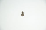 Full view of a vintage bronze African pineapple pendant showing its textured surface.