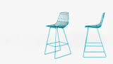 Pair of turquoise wire Lucy Counter Stools, displayed from front and side profiles.