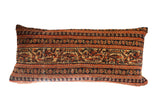 Hand-knotted vintage Persian rug fragment pillow, striped in terracotta, navy, and gold.