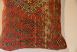 Detail of vintage Mir Serbend rug fragment pillow, muted red, beige, and blue design.