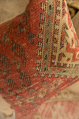 Woven texture of the antique Mir Serbend rug fragment pillow in rust and tan.