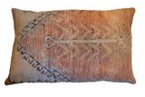 Vintage hand-knotted rug pillow with geometric design in muted orange and beige, 20x31 inches.