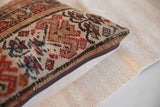 Close-up of antique 1920s Malayer hand-knotted pillow, highlighting geometric pattern and zipper.