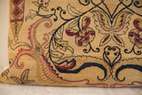 Unique mythological floral and vine motifs on antique Kerman rug pillow.
