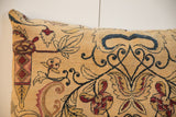 Detailed segment of the vintage Persian Kerman pillow, with beige, deep red, and dark blue floral vines.