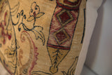 Antique Persian Kerman rug fragment pillow detail, tan, red, black mythological motifs.