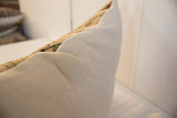 Side profile of oversized pillow with antique Persian Kerman rug fragment and light back.