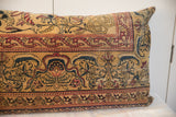 Antique Persian Kerman pillow featuring gold, ruby-red, and indigo vine and floral patterns.
