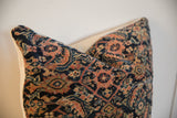 Vintage Fereghan pillow fragment revealing intricate navy, coral, and ivory hand-knotted pattern.