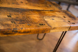 Reclaimed wood coffee table top with rustic texture, varied grain, and imperfections.