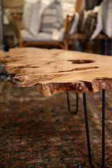 Expressive natural live edge and artistic wood grain of the coffee table.