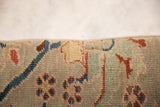 Close-up of antique Persian Sultanabad fragment pile, showing madder, cobalt, and seafoam floral vinery.