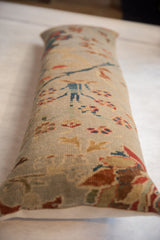 Close-up of antique Persian Sultanabad fragment pillow: seafoam green ground, floral vinery motif.