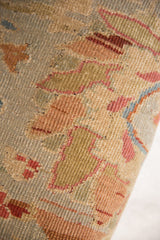 Articulated texture of antique Persian Sultanabad rug fragment featuring seafoam, olive, and madder floral vinery.