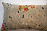Textural close-up of antique Persian Sultanabad rug pillow, with seafoam, cobalt, madder red floral vinery.