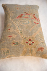 Hand-knotted texture of antique Sultanabad rug pillow with seafoam and red floral vinery.