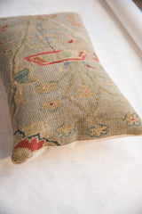 Textured antique Persian Sultanabad fragment pillow with seafoam green, madder red floral vinery.