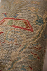 Hand-knotted pile and floral vinery detail on an antique Persian Sultanabad pillow.