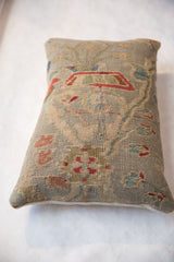 Textured pile of antique Persian Sultanabad pillow, with seafoam green floral vinery.