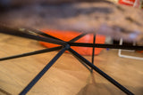 Black powder-coated steel spider leg base detail, showing its welded connection.