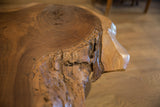 Rough, natural live edge texture of the handcrafted walnut coffee table.