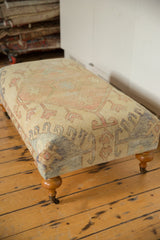 Vintage Turkish Rug Ottoman side displaying pale yellow, pink, blue geometric pattern and dye spots.
