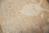 Curvilinear design on vintage Oushak ottoman rug with dramatic cream and gold pile sheen.