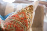 Textured hand-knotted surface of antique Belouch pillow, showing geometric coral design.
