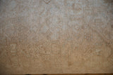 Vintage Rug Ottoman underside finished with neutral cotton canvas and brass studs.