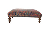 Collectible vintage Persian rug ottoman table, circa 1920s, navy, faded red, ivory motifs.
