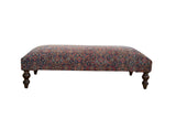 Vintage Persian Rug Ottoman Coffee Table, navy, red, gold allover pattern, turned wooden legs.