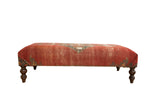 Finely woven antique Malayer rug fragment ottoman, deep rust with faded teal geometric patterns, 54 inches wide.