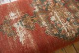 Close-up of finely woven antique Malayer rug fragment, rich terracotta, teal geometric patterns, and visible cotton foundation.